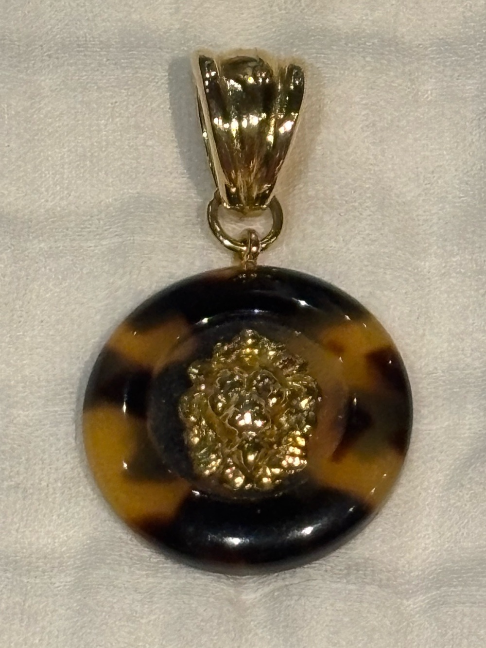 Vintage faux tortoiseshell and gold tone lion knocker style pendant